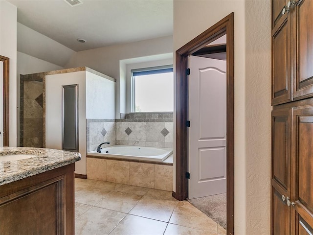 13705 Cascata Strada St, Oklahoma City, OK 73170 - bathroom featuring a bath, vanity, tile patterned floors, and tiled shower