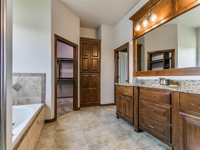 13705 Cascata Strada St, Oklahoma City, OK 73170 - full bathroom with a bath, vanity, and a walk in closet