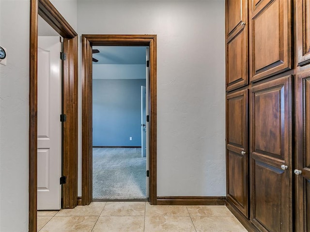 13705 Cascata Strada St, Oklahoma City, OK 73170 - corridor with light tile patterned floors and light colored carpet