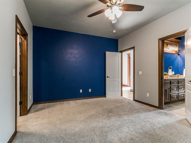 13705 Cascata Strada St, Oklahoma City, OK 73170 - unfurnished bedroom featuring light carpet, a ceiling fan, and connected bathroom