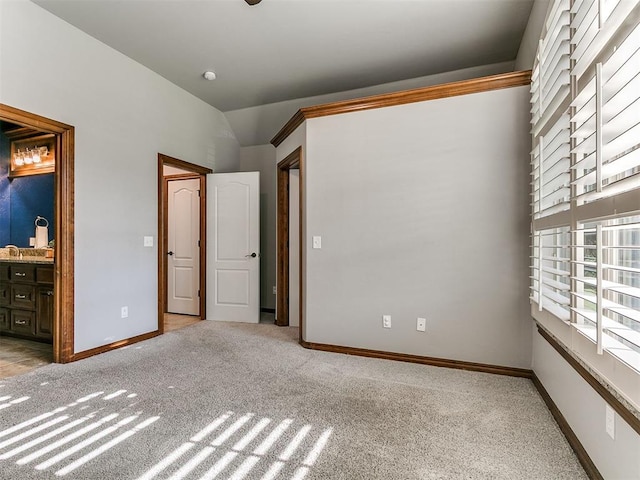 13705 Cascata Strada St, Oklahoma City, OK 73170 - unfurnished bedroom featuring carpet floors, vaulted ceiling, and ensuite bath