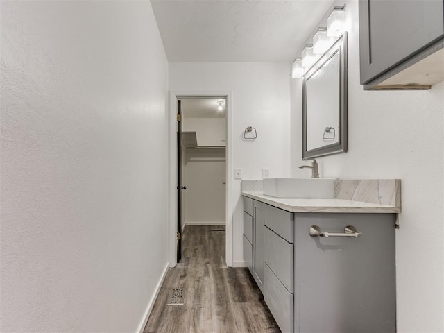 704 NW 137th St, Edmond, OK 73013 - bathroom with vanity and wood finished floors