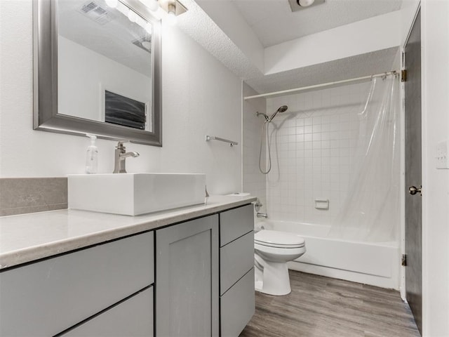 704 NW 137th St, Edmond, OK 73013 - full bathroom with vanity, shower / bath combo with shower curtain, and wood finished floors