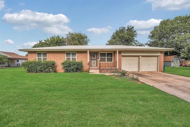 1905 N Oregon Ave, Mangum, OK 73554 - ranch-style home featuring brick siding, a garage, driveway, and a front lawn