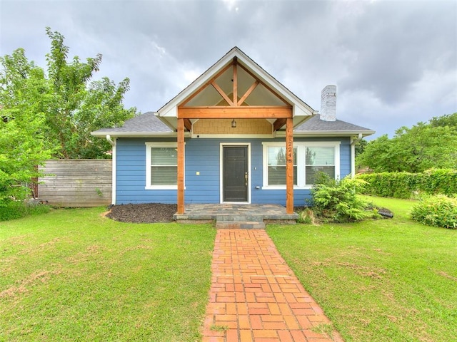 2248 NW 22nd St, Oklahoma City, OK 73107 - bungalow featuring a chimney