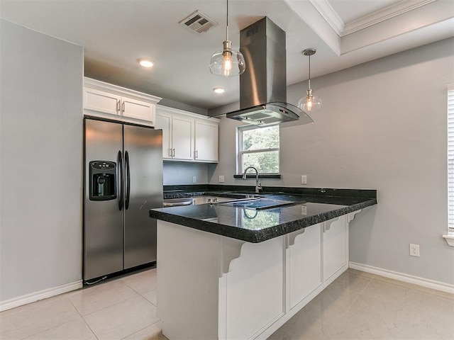 2248 NW 22nd St, Oklahoma City, OK 73107 - kitchen with stainless steel fridge, island exhaust hood, a peninsula, white cabinets, and ornamental molding