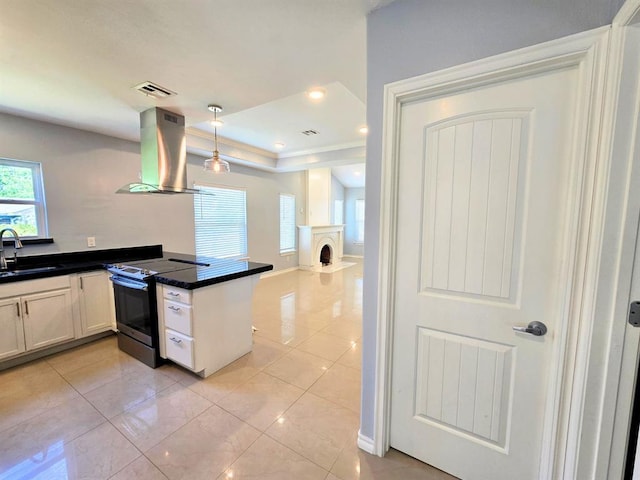 2248 NW 22nd St, Oklahoma City, OK 73107 - kitchen featuring stainless steel electric stove, island exhaust hood, dark countertops, light tile patterned floors, and hanging light fixtures