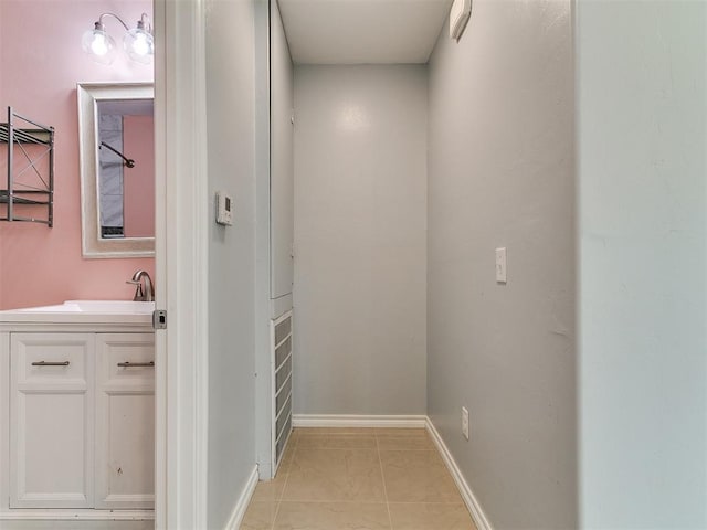 2248 NW 22nd St, Oklahoma City, OK 73107 - hallway featuring a sink and baseboards