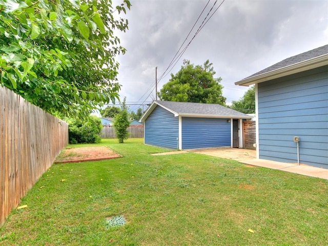 2248 NW 22nd St, Oklahoma City, OK 73107 - fenced backyard with an outbuilding and a garage