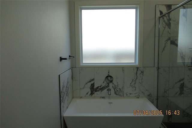 15901 Sarno Ln, Edmond, OK 73013 - bathroom featuring a freestanding tub