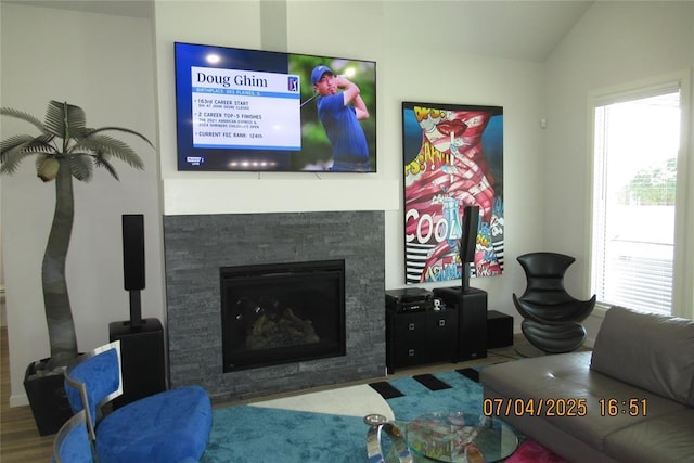 15901 Sarno Ln, Edmond, OK 73013 - living area with healthy amount of natural light, a fireplace, and vaulted ceiling