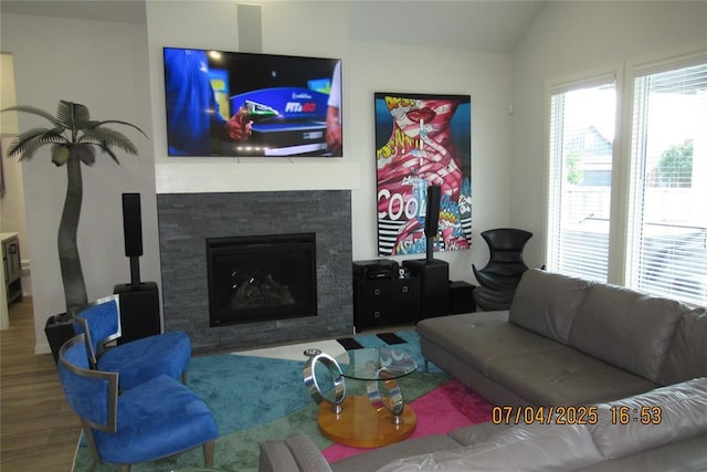 15901 Sarno Ln, Edmond, OK 73013 - living room with wood finished floors, a fireplace, and lofted ceiling