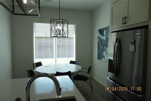 15901 Sarno Ln, Edmond, OK 73013 - dining room with a chandelier and wood finished floors