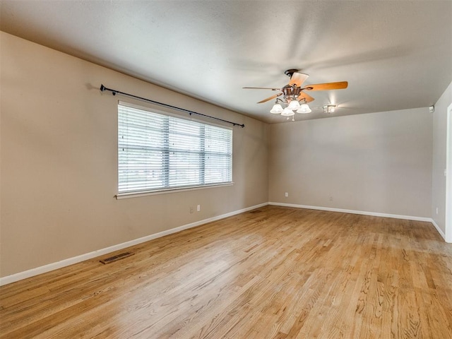 119 Thompson Dr, Moore, OK 73160 - empty room featuring a ceiling fan and light wood finished floors