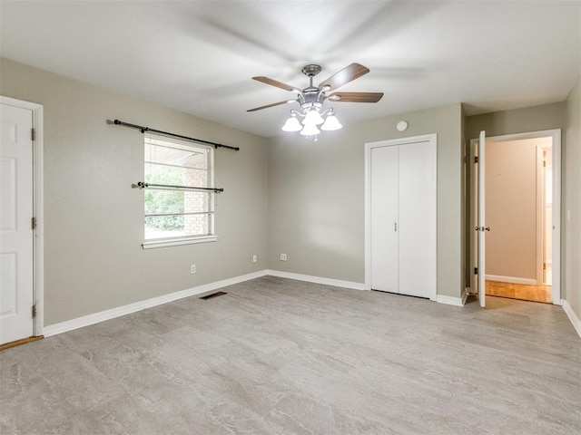 119 Thompson Dr, Moore, OK 73160 - unfurnished bedroom featuring baseboards and a ceiling fan