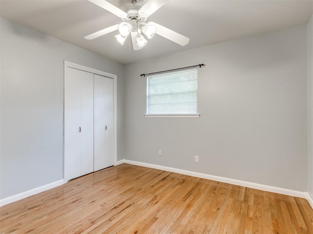119 Thompson Dr, Moore, OK 73160 - unfurnished bedroom featuring a closet, light wood-style flooring, and a ceiling fan