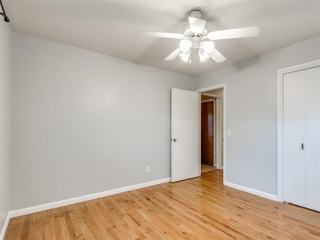 119 Thompson Dr, Moore, OK 73160 - unfurnished bedroom with light wood-type flooring, ceiling fan, and a closet