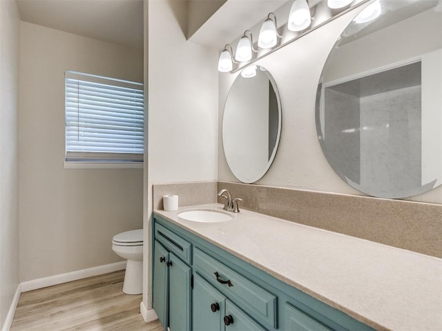 119 Thompson Dr, Moore, OK 73160 - bathroom featuring vanity and wood finished floors
