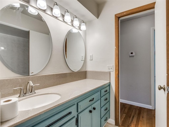 119 Thompson Dr, Moore, OK 73160 - bathroom featuring vanity and wood finished floors