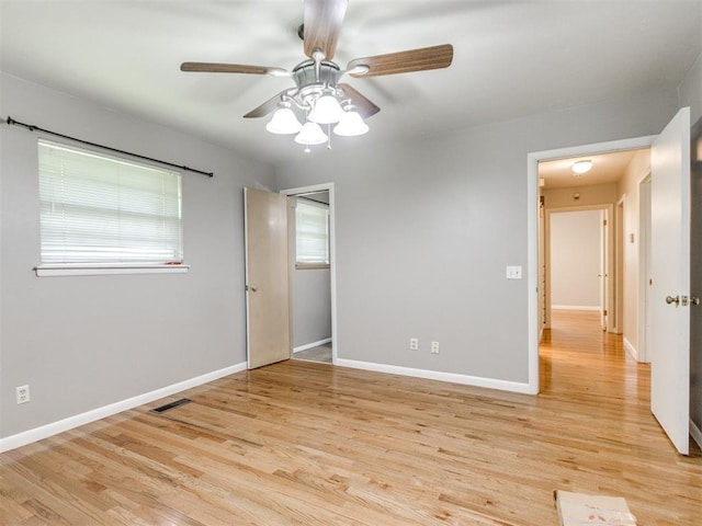 119 Thompson Dr, Moore, OK 73160 - unfurnished bedroom with light wood-style floors and ceiling fan