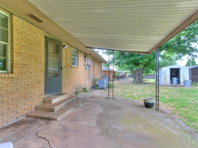 119 Thompson Dr, Moore, OK 73160 - view of patio with a storage unit and entry steps
