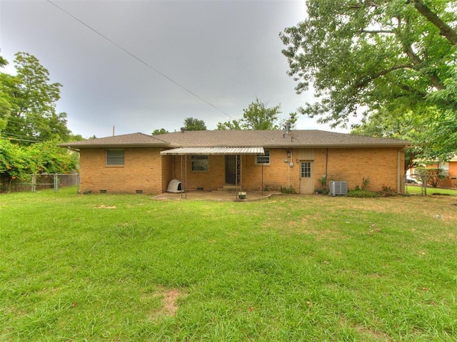 119 Thompson Dr, Moore, OK 73160 - back of property with a patio, brick siding, and crawl space