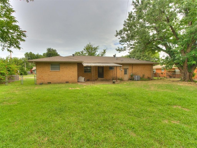 119 Thompson Dr, Moore, OK 73160 - back of property with crawl space, brick siding, and a patio area