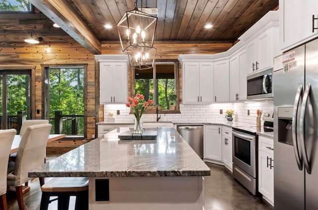 2105 Pine Hills Rd, Broken Bow, OK 74728 - kitchen featuring appliances with stainless steel finishes, wood ceiling, decorative backsplash, recessed lighting, and white cabinets