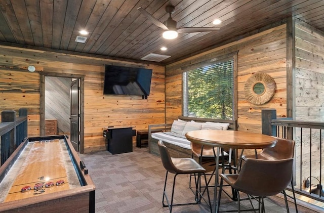 2105 Pine Hills Rd, Broken Bow, OK 74728 - carpeted dining space featuring wood walls, wood ceiling, a ceiling fan, and recessed lighting
