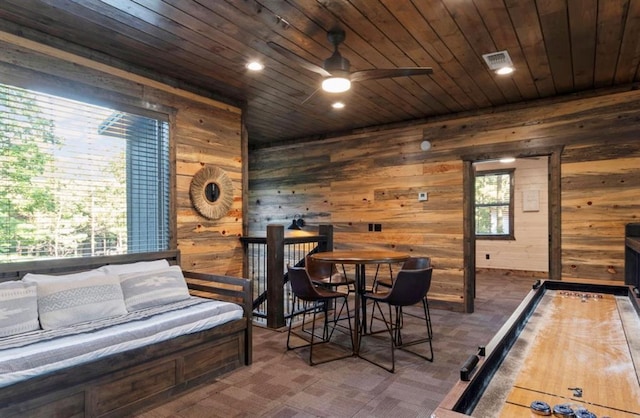 2105 Pine Hills Rd, Broken Bow, OK 74728 - playroom featuring wood ceiling, wooden walls, a ceiling fan, and recessed lighting