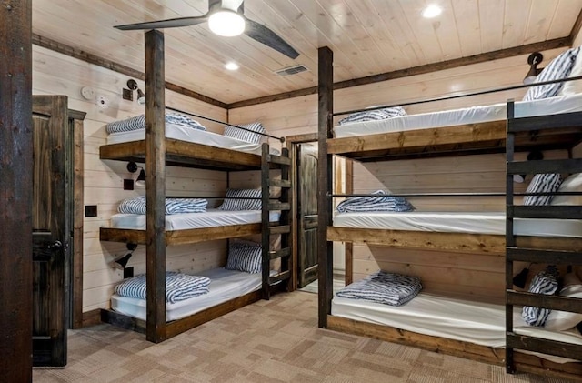 2105 Pine Hills Rd, Broken Bow, OK 74728 - unfurnished bedroom with wood ceiling, wood walls, recessed lighting, and carpet floors