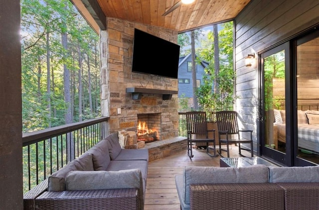 2105 Pine Hills Rd, Broken Bow, OK 74728 - sunroom featuring an outdoor living space with a fireplace and plenty of natural light