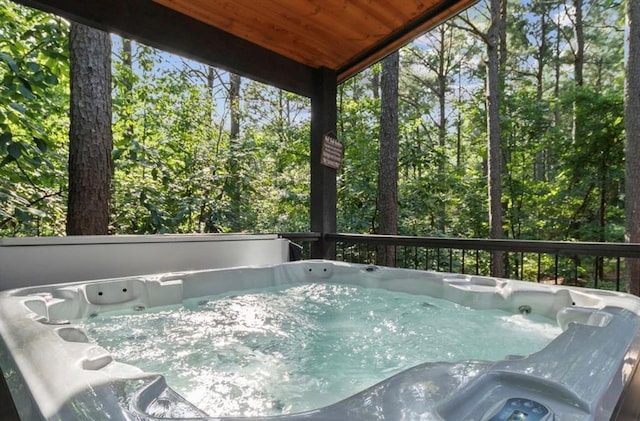 2105 Pine Hills Rd, Broken Bow, OK 74728 - sunroom / solarium featuring a hot tub