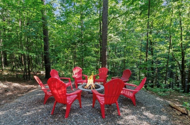 2105 Pine Hills Rd, Broken Bow, OK 74728 - view of yard featuring a fire pit and a view of trees