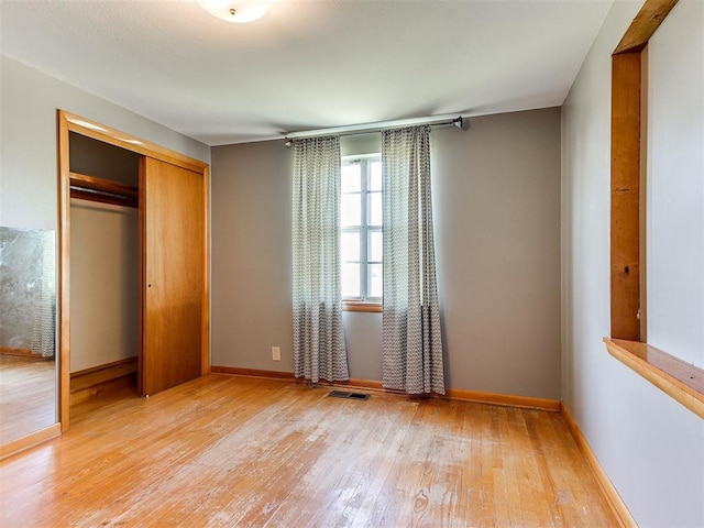 3240 SW 119th St, Oklahoma City, OK 73170 - unfurnished bedroom with a closet and hardwood / wood-style flooring