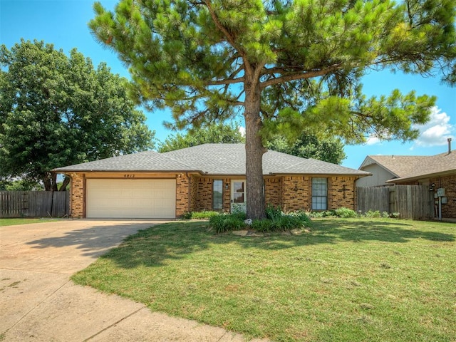 4812 Hunton Ter, Yukon, OK 73099 - single story home with concrete driveway, a garage, brick siding, and a shingled roof