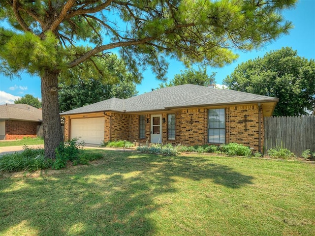 4812 Hunton Ter, Yukon, OK 73099 - ranch-style home with brick siding, an attached garage, a chimney, and driveway