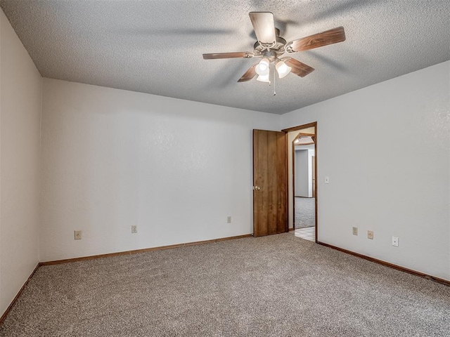 4812 Hunton Ter, Yukon, OK 73099 - spare room featuring carpet floors, a ceiling fan, and a textured ceiling