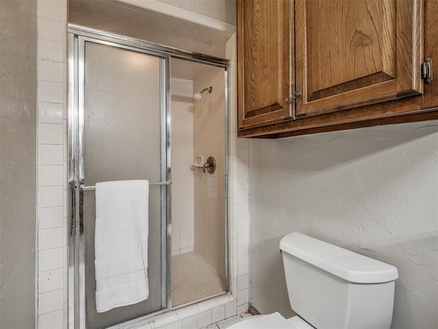 4812 Hunton Ter, Yukon, OK 73099 - full bathroom featuring a stall shower and a textured wall
