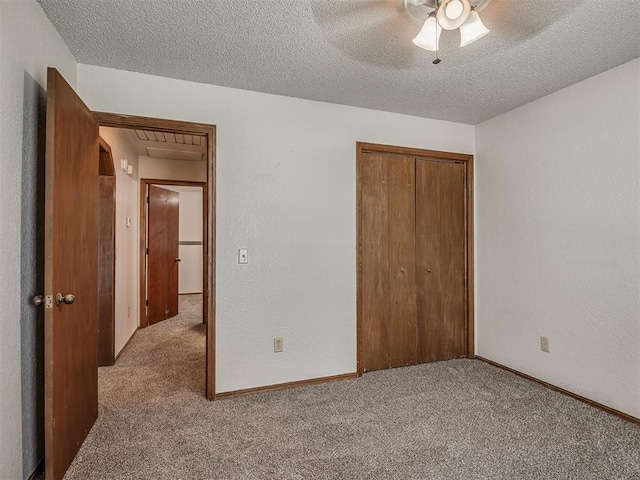 4812 Hunton Ter, Yukon, OK 73099 - unfurnished bedroom featuring carpet floors, a closet, a textured ceiling, and ceiling fan