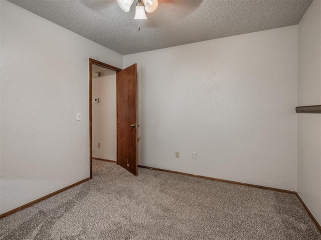 4812 Hunton Ter, Yukon, OK 73099 - empty room with carpet, a ceiling fan, a textured ceiling, and a textured wall