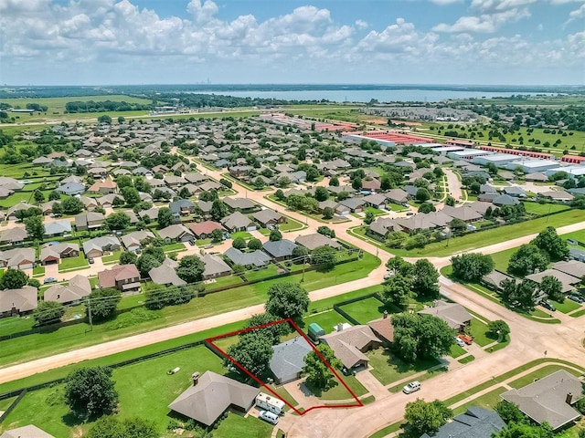 4812 Hunton Ter, Yukon, OK 73099 - aerial perspective of suburban area with property boundaries highlighted and a large body of water