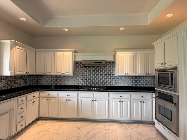 1016 Erinova Dr, Yukon, OK 73099 - kitchen featuring stainless steel appliances, recessed lighting, light marble finish floors, and white cabinets