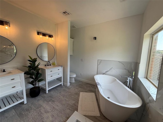 1016 Erinova Dr, Yukon, OK 73099 - bathroom with vanity and a freestanding bath