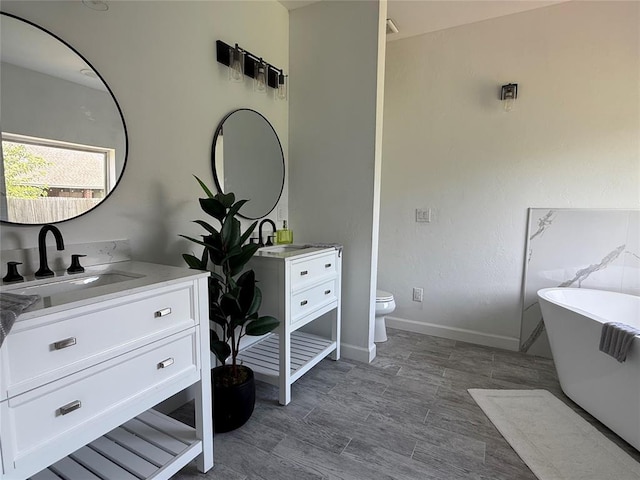 1016 Erinova Dr, Yukon, OK 73099 - bathroom featuring vanity and a freestanding bath