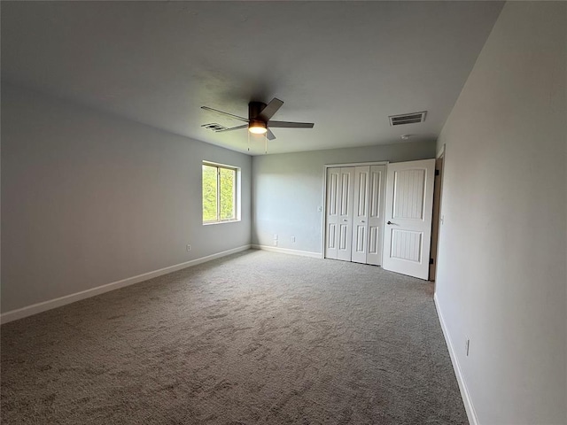 1016 Erinova Dr, Yukon, OK 73099 - unfurnished bedroom with carpet flooring, ceiling fan, and a closet