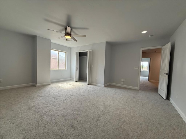 1016 Erinova Dr, Yukon, OK 73099 - unfurnished bedroom with light colored carpet, a ceiling fan, and recessed lighting