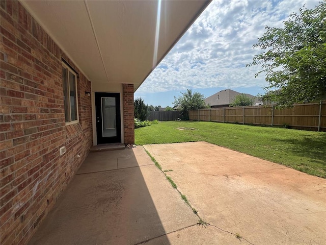 1016 Erinova Dr, Yukon, OK 73099 - fenced backyard featuring a patio