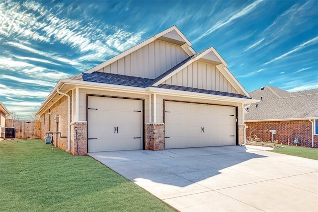 1624 NE 32nd St, Moore, OK 73160 - view of front of house with board and batten siding, an attached garage, driveway, and brick siding
