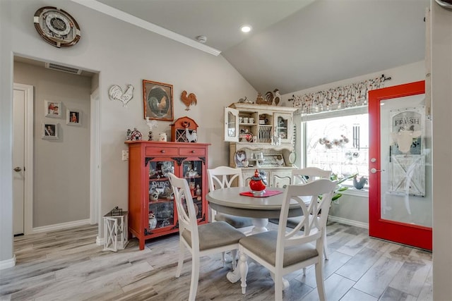 1624 NE 32nd St, Moore, OK 73160 - dining space with vaulted ceiling and light wood-type flooring
